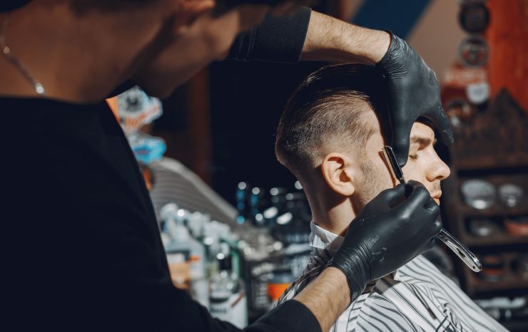 stylish-man-sitting-in-a-barbershop-EYR3SFA.jpg