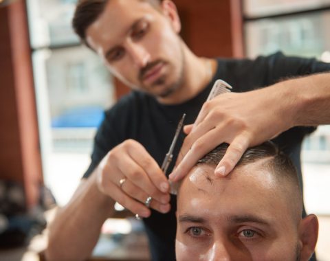 young-man-at-the-barbershop-SQDLUPM.jpg